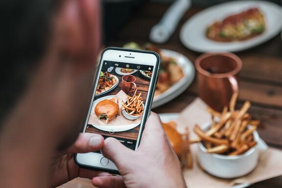 People reading menu on mobile